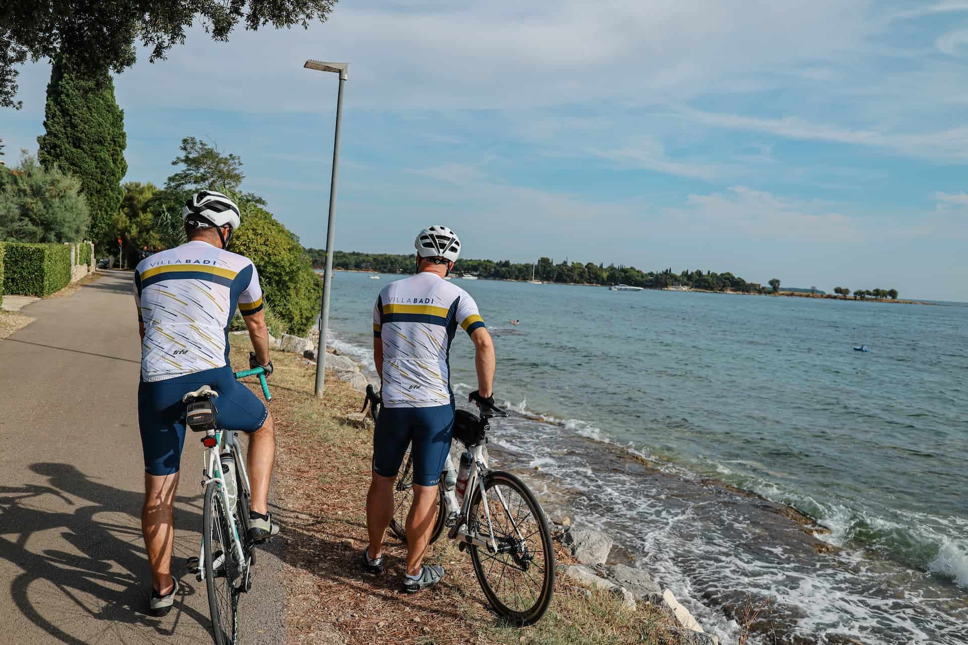 Cyclists by a scenic coastal bike path